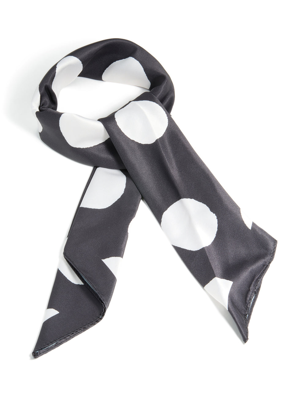Showcasing a black and white statement polka dot fabric scarf front view