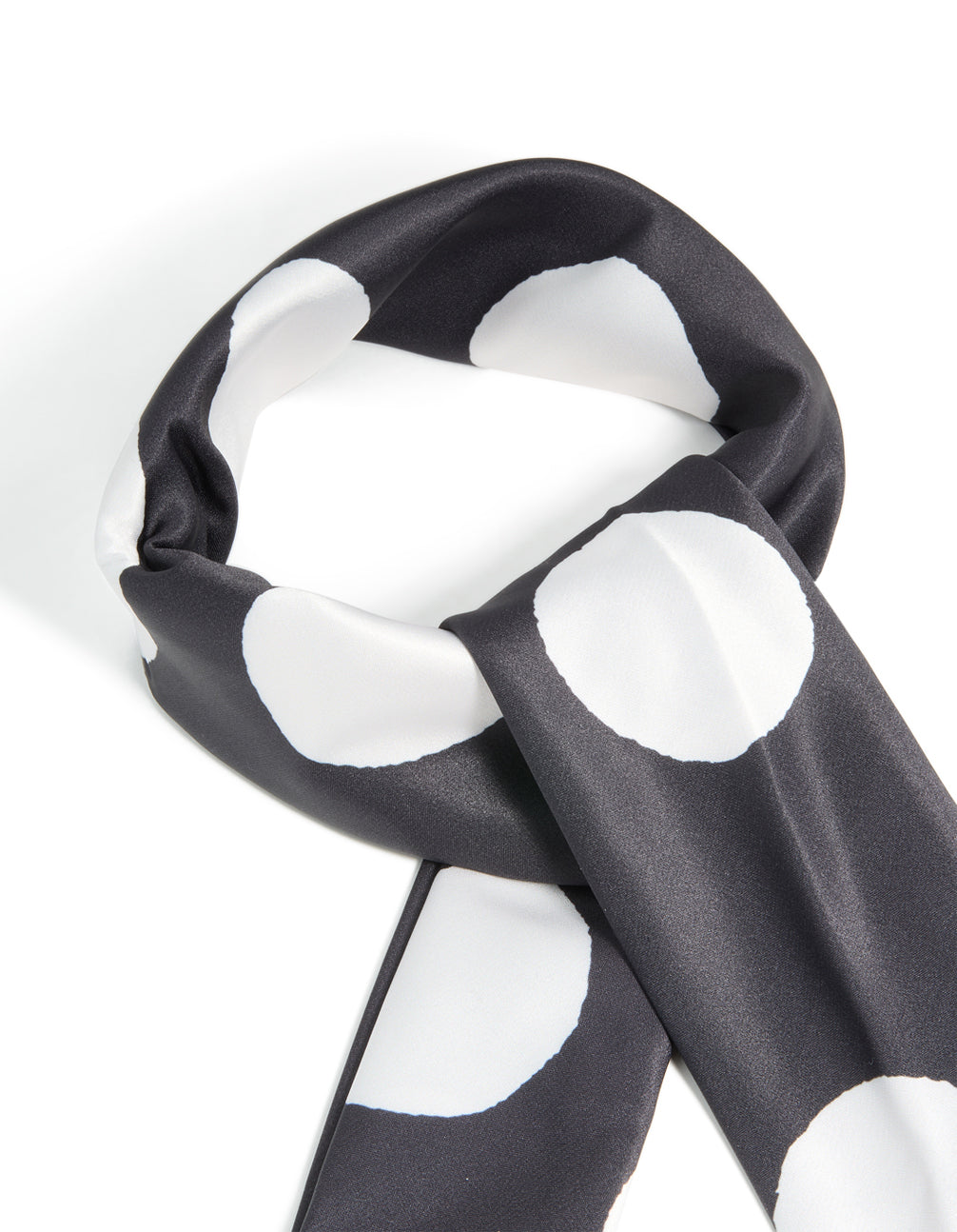 Crafted from black and white statement polka dot fabric scarf detail view