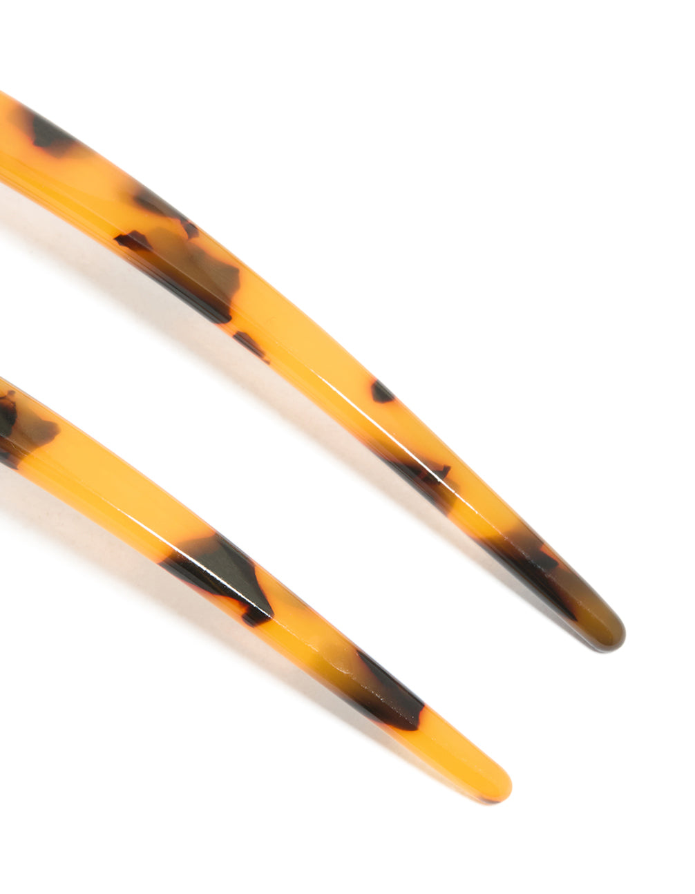 Crafted from tortoiseshell acrylic, this large basic hair pin features animal-leopard print in goldenrod, chocolate, and black detail view