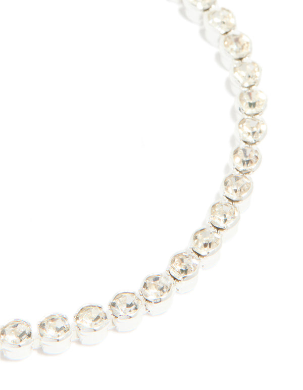 Highlighting the silver plated diamante tennis bracelet with detailed view of individual stone settings close up view