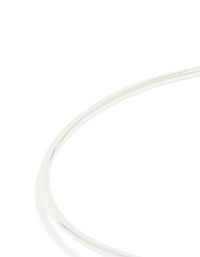 Explore a silver plated cubic zirconia floating wrap around bangle with statement style close up view - link has visual effect only