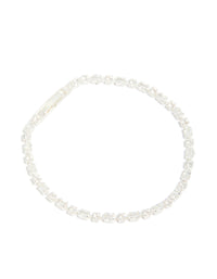 Elegantly designed silver plated cubic zirconia dainty oval tennis bracelet in front view - link has visual effect only