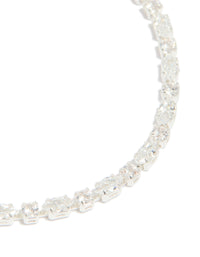 Highlighting the oval cut cubic zirconia stones, this silver plated dainty tennis bracelet is presented in close up view - link has visual effect only