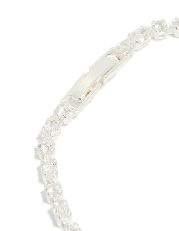 Showcasing the secure fastening mechanism, this silver plated cubic zirconia dainty oval tennis bracelet features a closure detail view