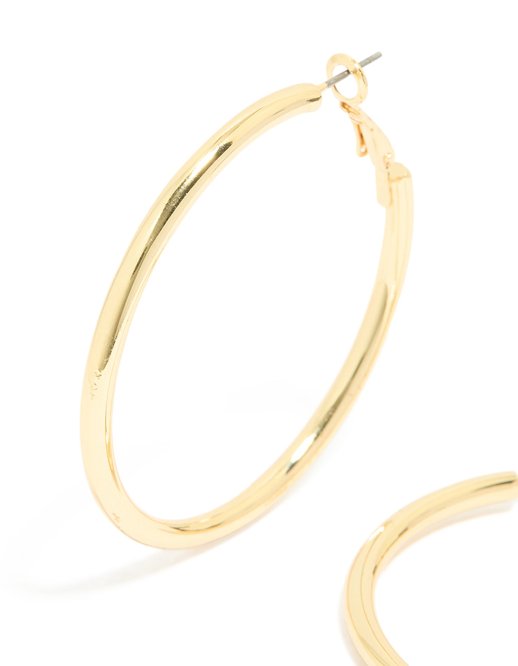 Crafted from gold plated material, thick hoop earrings with statement and chunky style close up view