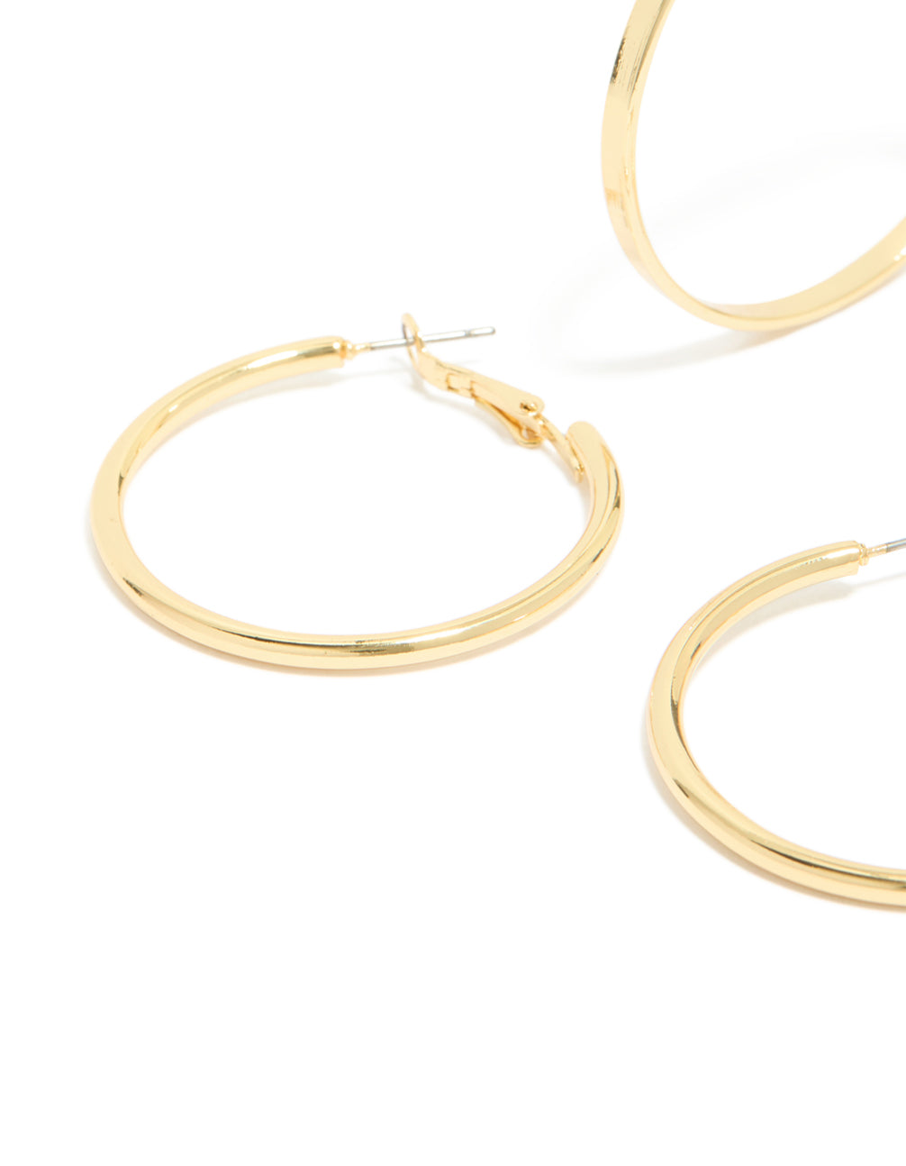 Highlighting thick flat hoop earrings in a 2-pack, crafted from gold plated material with chunky styling close up view