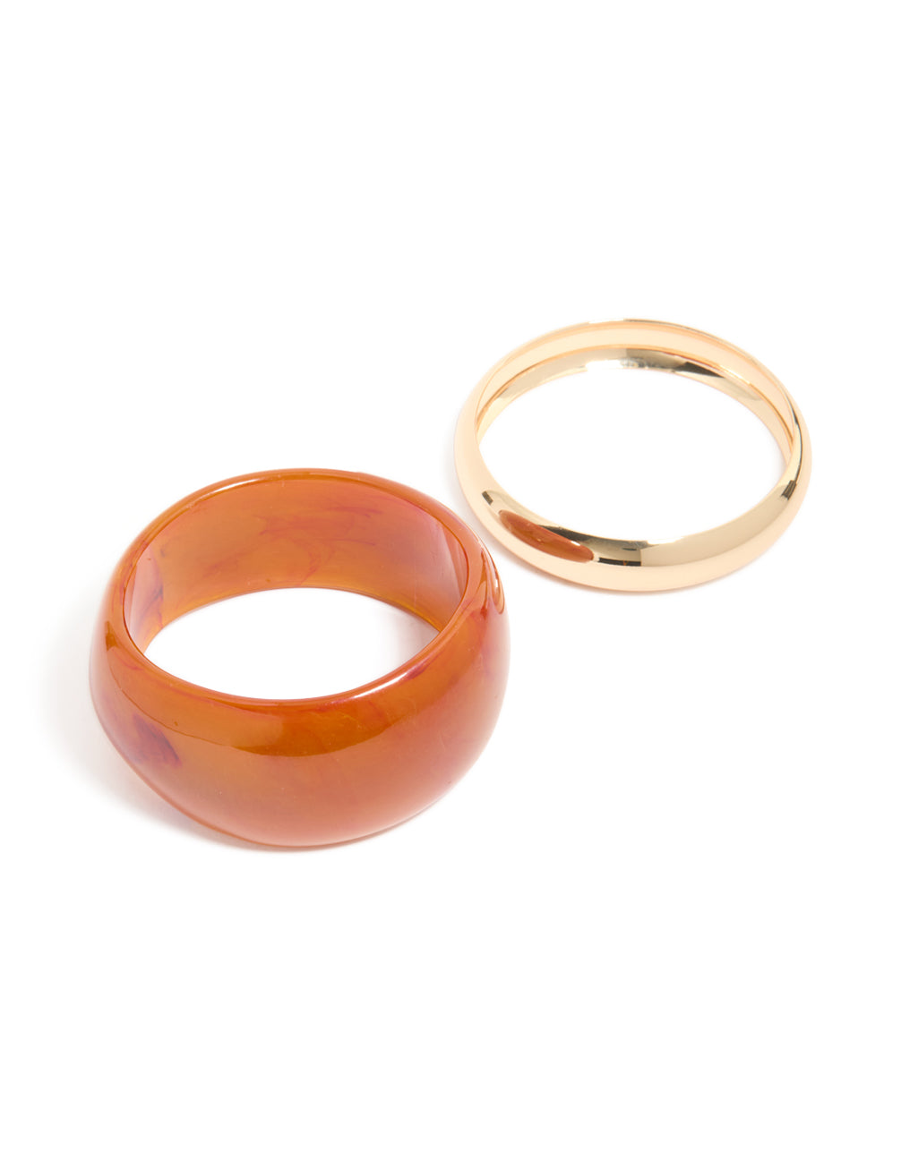 Discover a 2-pack of gold and brown acrylic thick bangles with chunky statement styling front view