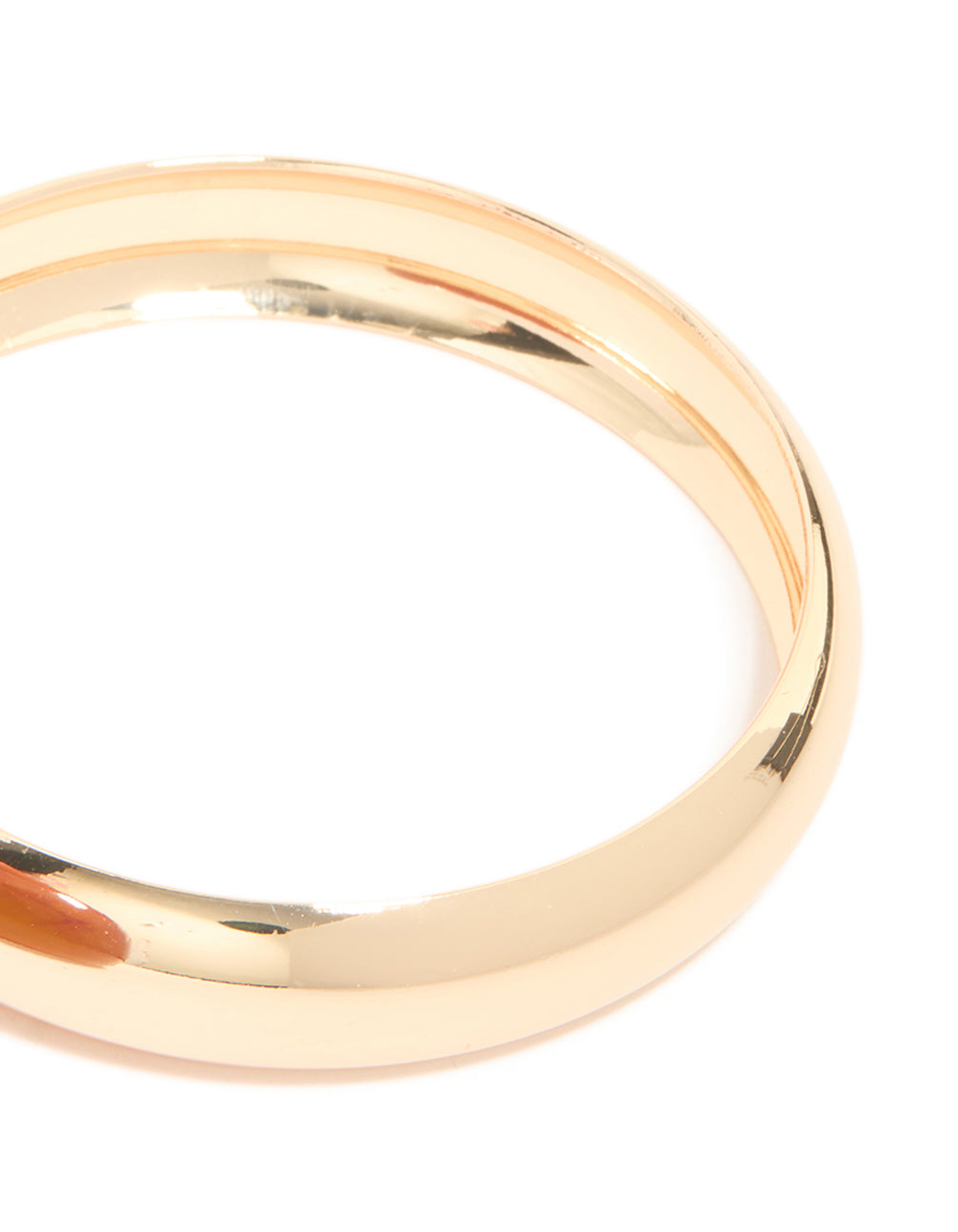 Featuring a 2-pack of gold and brown acrylic thick bangles with chunky statement design close up view