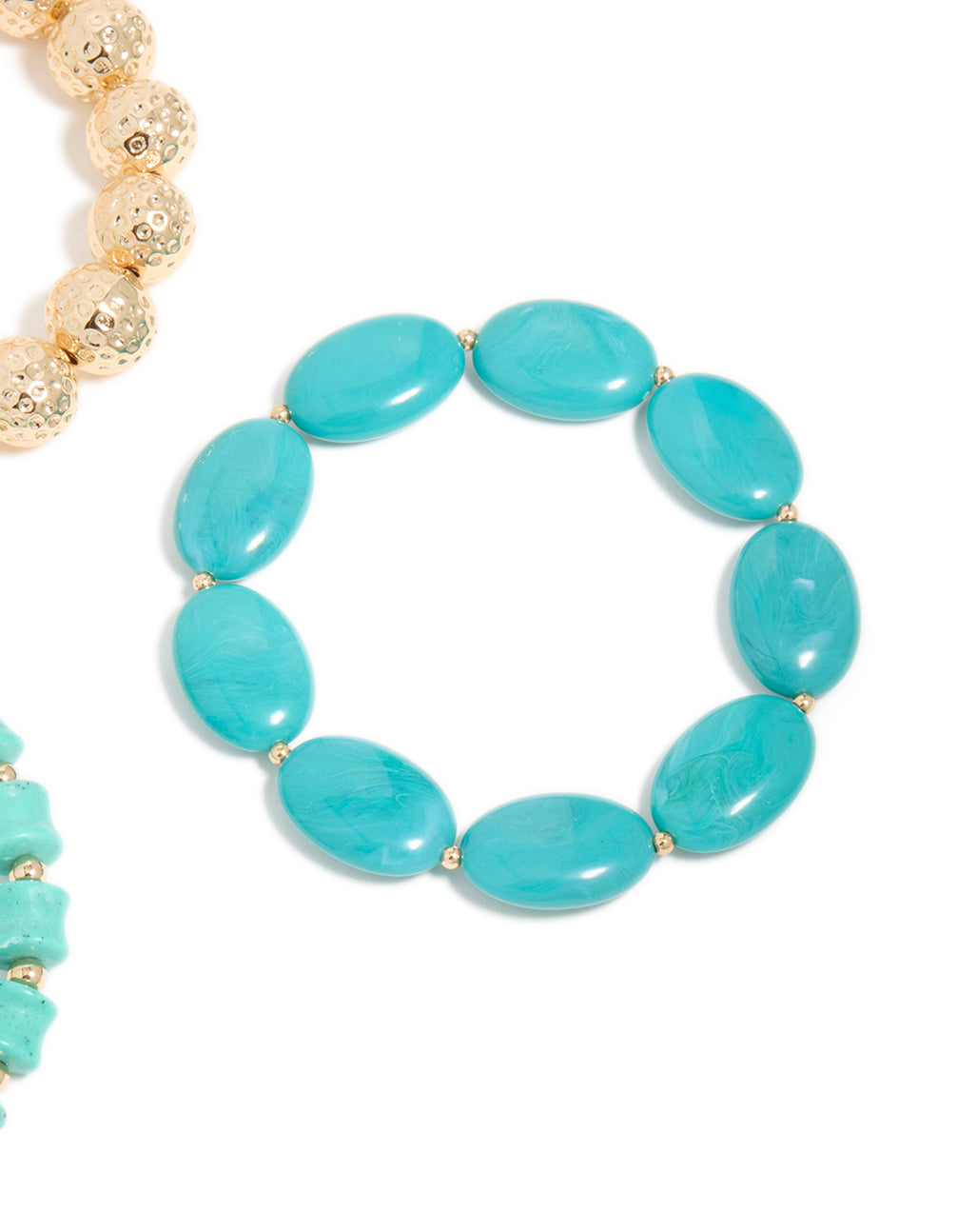 Showcasing beaded stretch bracelets crafted from turquoise with balls in a 3-pack close up view