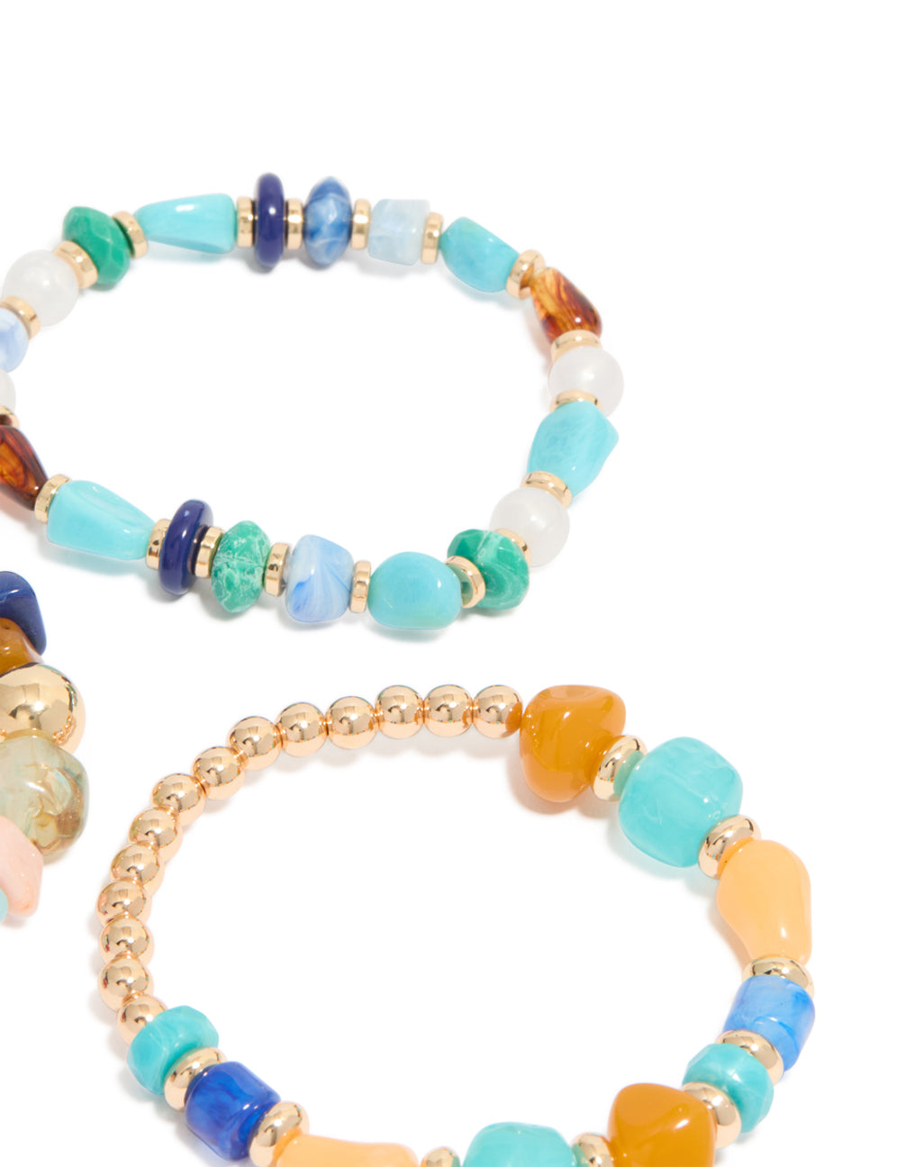 Featuring multicoloured beaded irregular shape bracelets in a 3-pack with turquoise material and gold, blue and white accents close up view