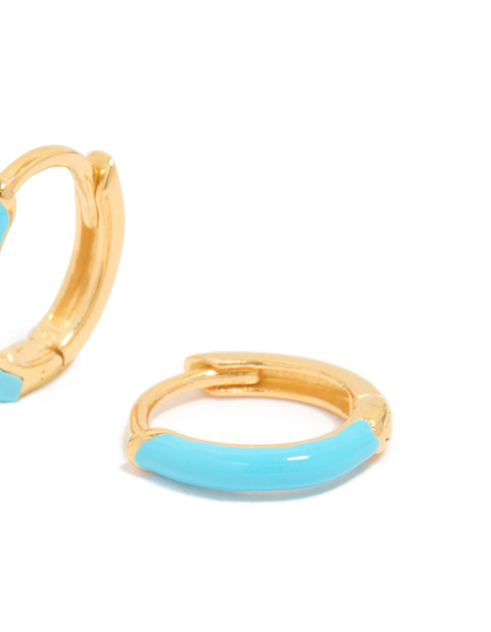 Designed with gold plated sterling silver light blue enamel huggie earrings featuring turquoise accents and huggie closure post detail view