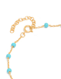 Designed with gold plated sterling silver and blue enamel beads in turquoise station bracelet closure detail view - link has visual effect only