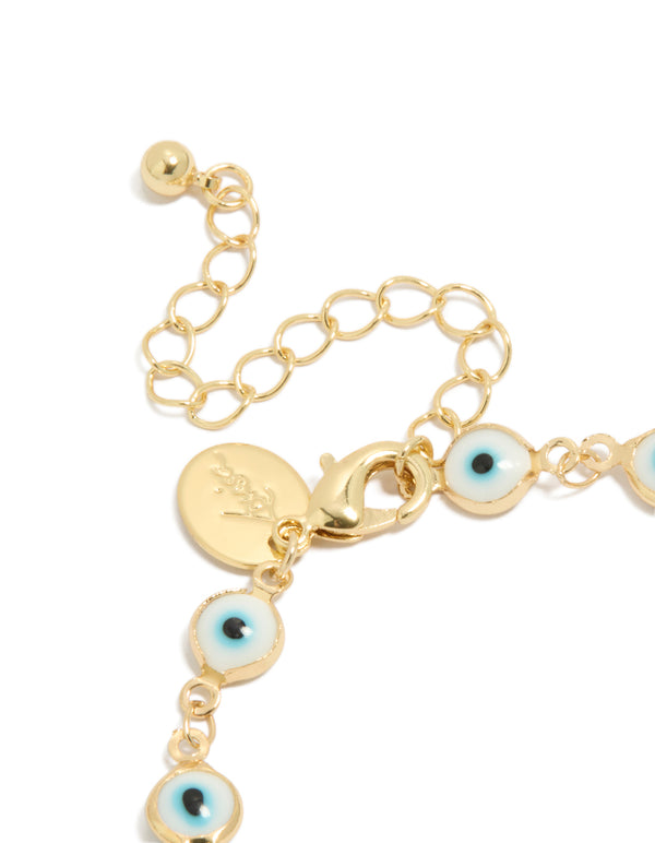 A gold plated brass evil eye chain bracelet with statement style closure detail view