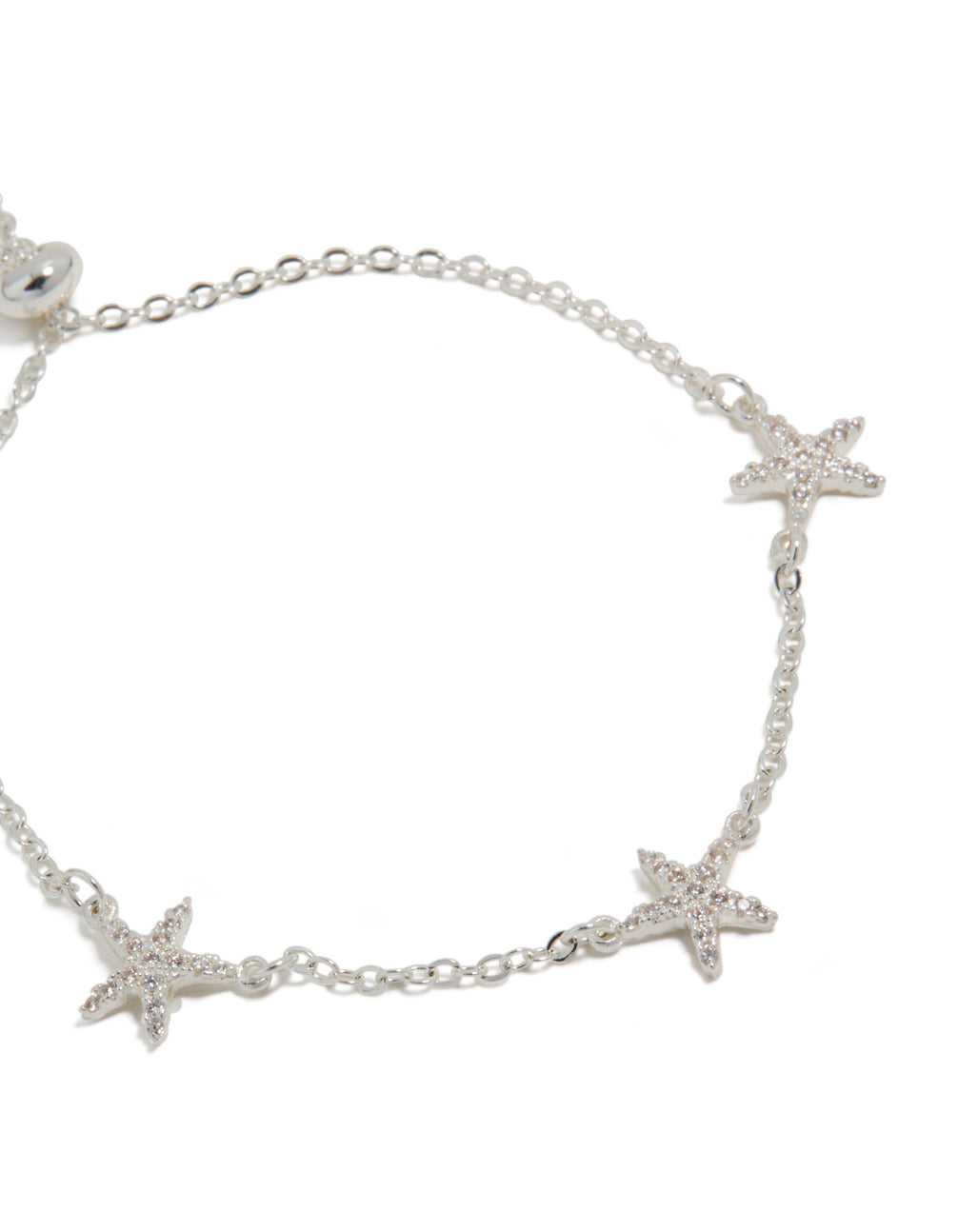 Featuring delicate starfish charms, this silver plated cubic zirconia pave toggle bracelet in close up view