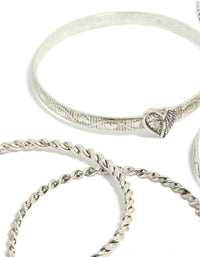 Showcasing silver textured and plain bangles 6-pack with bird, celestial and heart detail in close up view - link has visual effect only