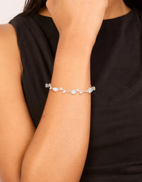 Elegantly designed dainty vine bracelet with cubic zirconia stones in silver and clear on wrist view - link has visual effect only