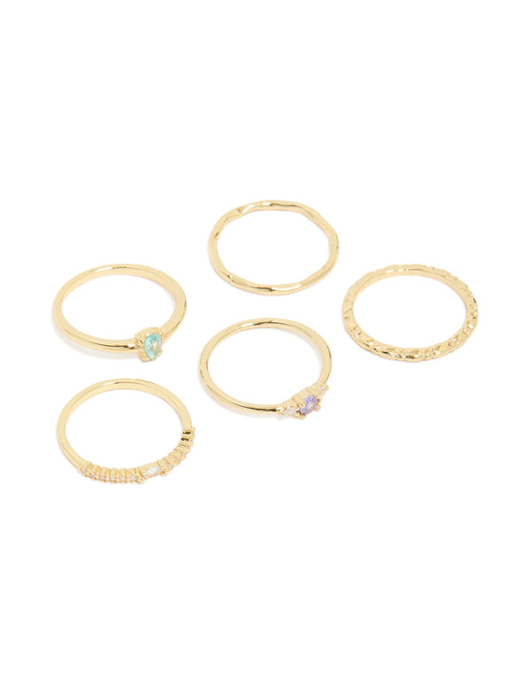 Showcasing gold plated crystal cubic zirconia stackable rings in aqua lavender and clear stones front view