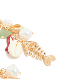 Crafted from gold metal, these fish drop earrings feature ocean animal charms with shell, pearl, and bead details in coral and mint cream with a post detail view - link has visual effect only