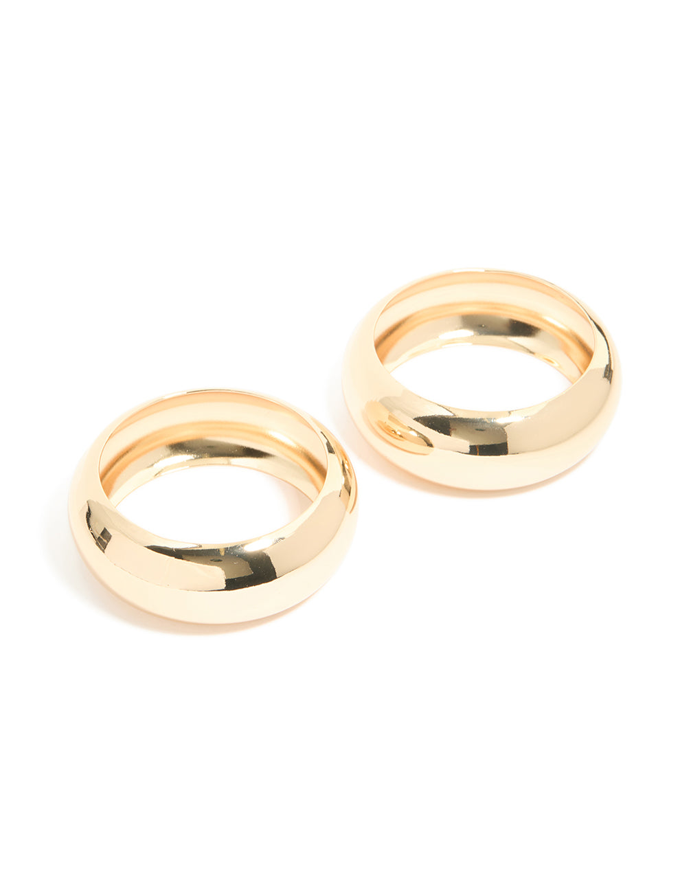 Discover a 2-pack of gold oversized chunky statement bangles front view