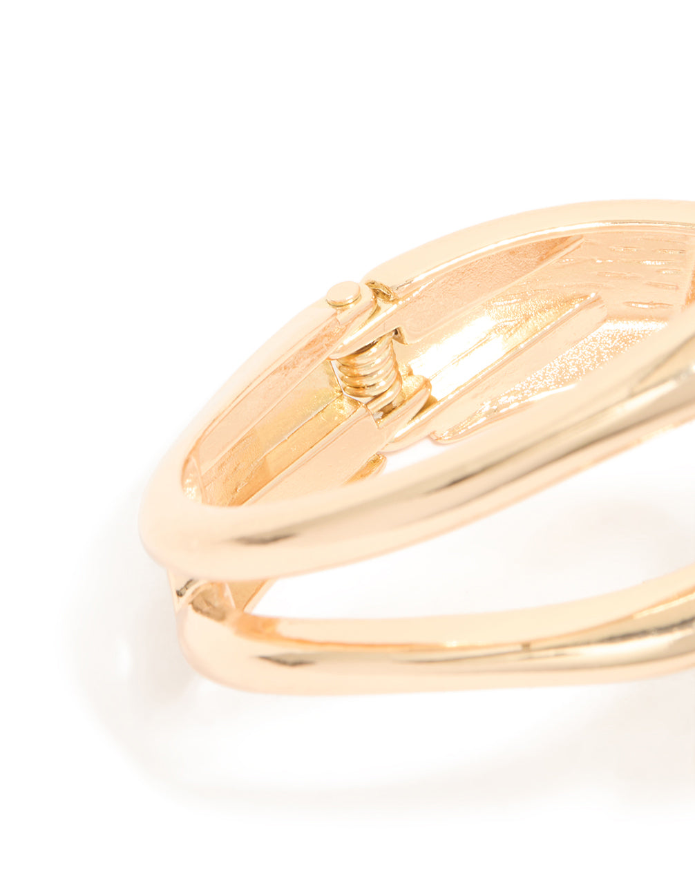 Highlighting the gold wrapped loop hinged bangle with closure detail view