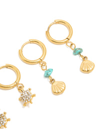 Showcasing waterproof gold plated stainless steel huggie earrings featuring shell turquoise ocean accents in a 2-pack post detail view - link has visual effect only