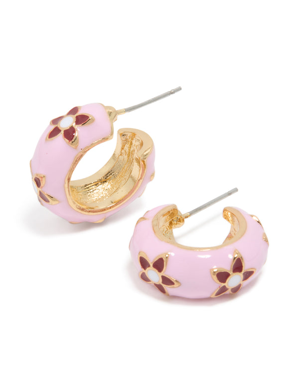 Showcasing gold pink acrylic flower huggie earrings with floral pattern in light pink and maroon hues front view