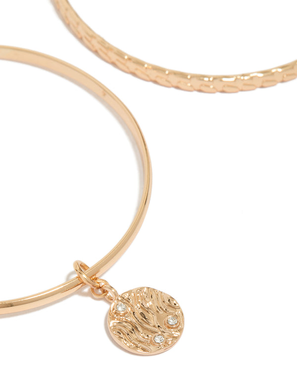 Highlighting the diamante textured bangle 2-pack in gold close up view