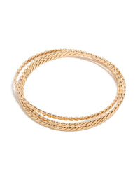 Showcasing a twisted Russian bangle in gold front view - link has visual effect only
