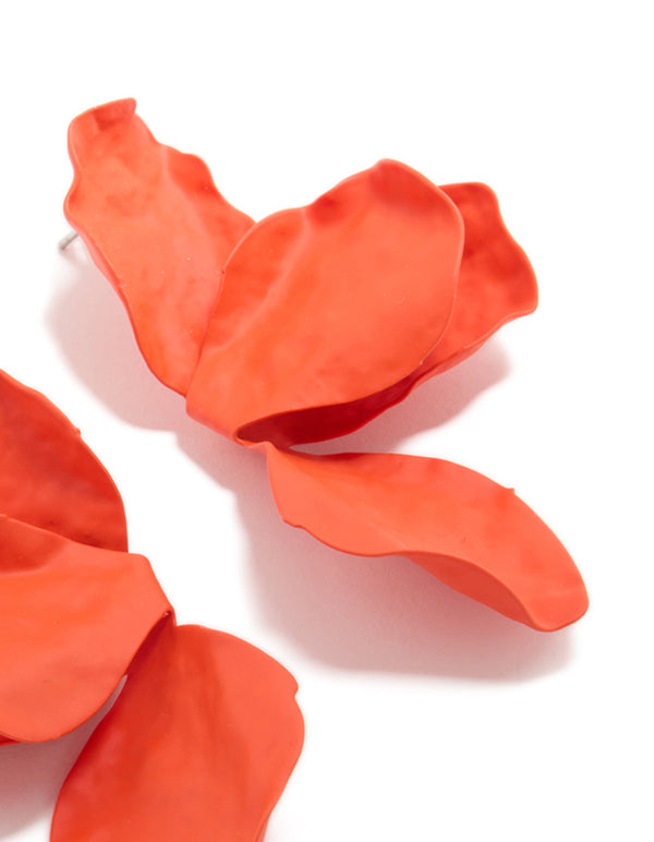 Presenting orange coated metal flower petal drop earrings with floral design in post detail view