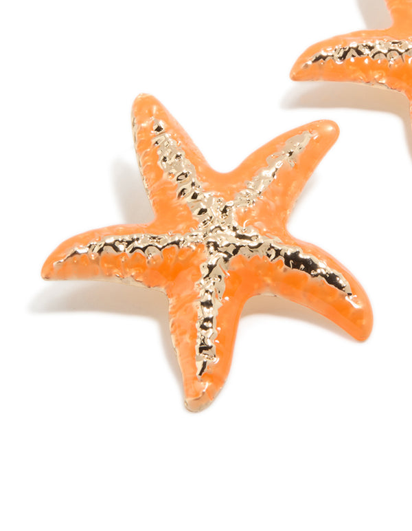 Crafted from orange coated metal with starfish statement stud design featuring ocean inspired gold accents close up view