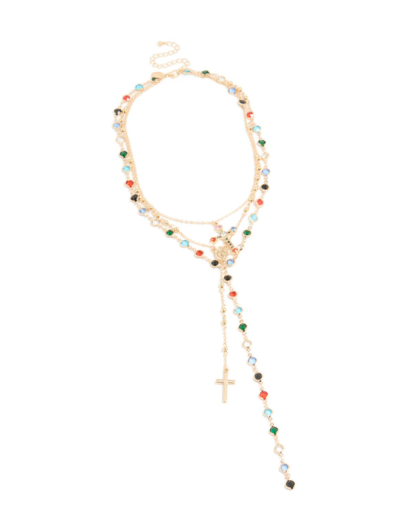 Beautifully crafted gold layered Y-necklace with charm, beads, coin, and cross featuring crystal glass stones in statement style front view