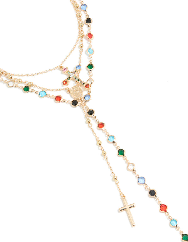 Explore this gold layered Y-necklace featuring charm, beads, coin, and cross details with crystal glass stones in statement style close up view
