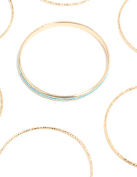 Featuring glitter bangles in gold with turquoise accents close up view - link has visual effect only