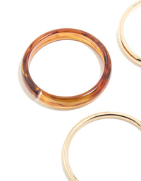 Crafted from acrylic, this gold, brown and blue 4-pack bangle set close up view - link has visual effect only