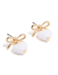 Featuring gold bow and white bubble heart drop earrings front view - link has visual effect only