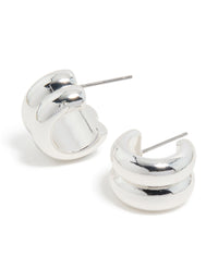 Showcasing chunky ribbed huggie earrings in silver with front view - link has visual effect only
