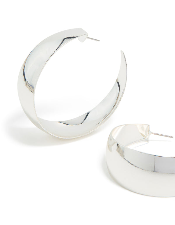 Featuring silver plated smooth thick hoop earrings with closure close up view