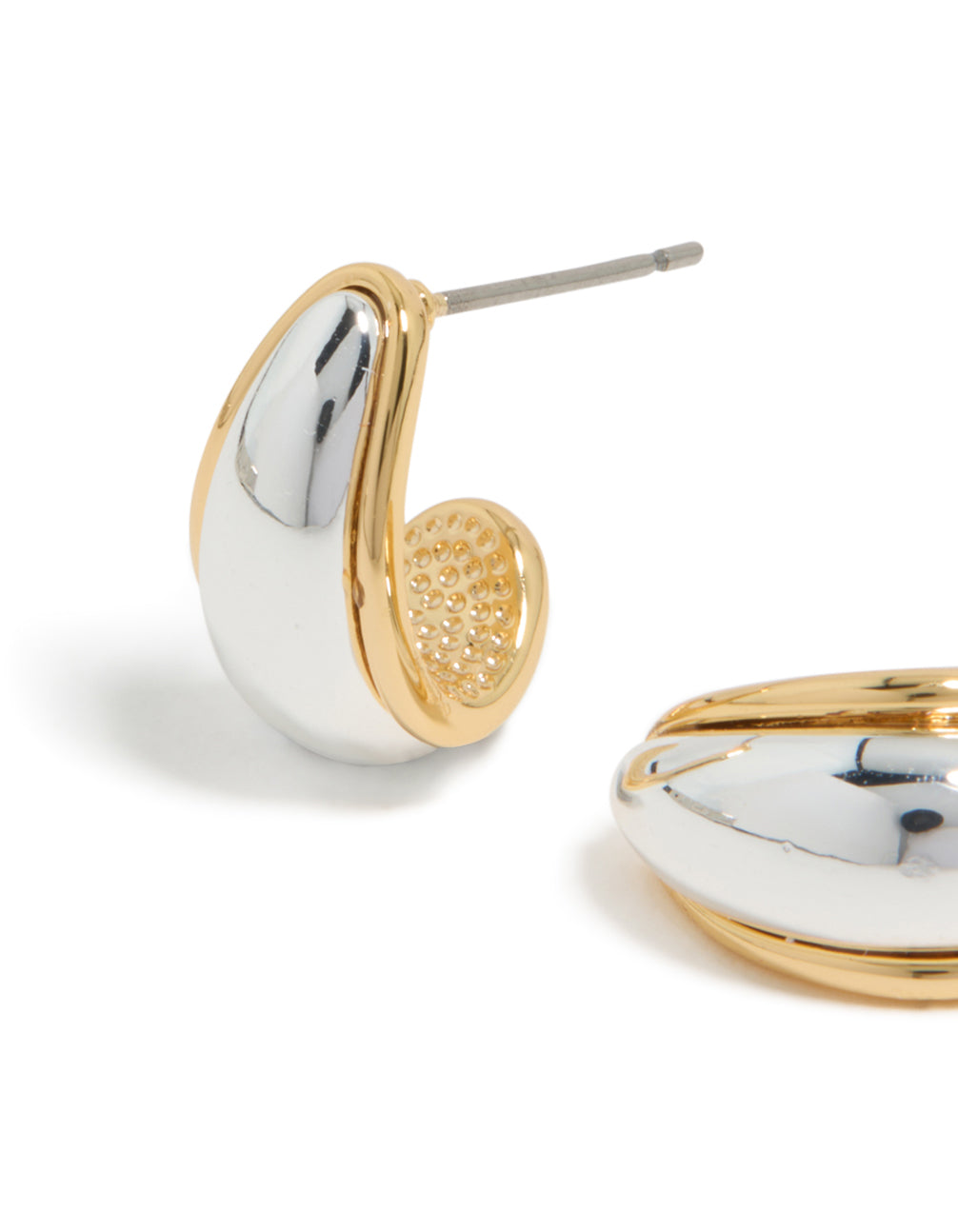 Highlighting mixed metal plated small teardrop drop earrings in silver and gold close up view