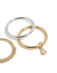 Crafted from mixed metal plated organic cubic zirconia rings 4-pack with charm in gold and silver side detail view - link has visual effect only