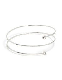 Crafted from silver, this diamante thin wrap arm cuff bangle features a coiled design front view - link has visual effect only