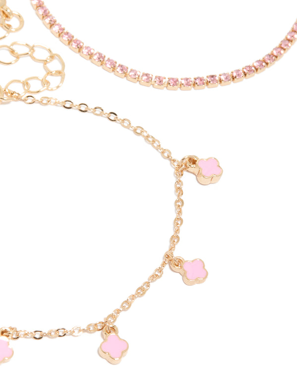 Crafted from gold pink flower charm bracelets in a 4-pack close up view