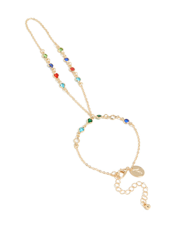 Showcasing a statement hand chain in multicolor diamantes featuring green, red, and blue stones front view