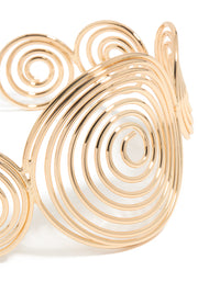 Featuring a gold multi swirl arm cuff bangle with statement design close up view - link has visual effect only