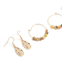 Showcasing gold beaded hoop and drop earrings 3-pack with charms featuring hoop closure in orange, tan, and coral tones close up view - link has visual effect only