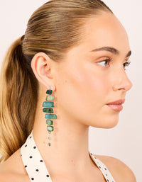 Discover dark green acrylic irregular shaped drop earrings with beads in teal, pale green, and gold on model view - link has visual effect only