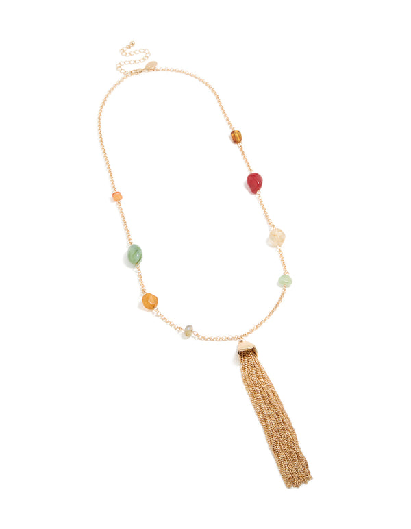 Showcasing long chain beaded, tassel statement necklace with gold and multicoloured elements front view