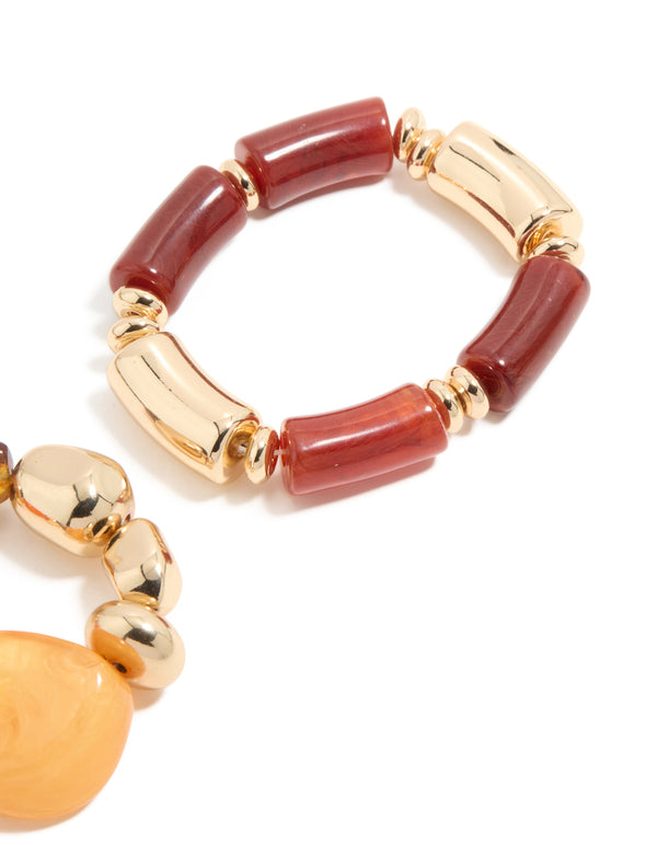 Presenting beaded stretch bracelets in a 2-pack crafted from irregular acrylic with gold accents in maroon, orange, and peachpuff colors, detail view
