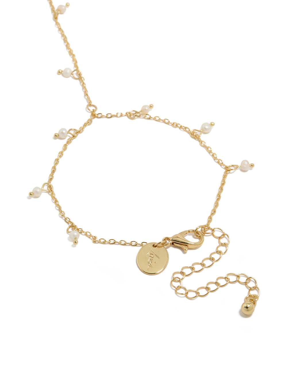 Explore this gold plated mini freshwater pearl droplet hand chain designed with charm in dainty statement style closure detail view