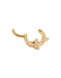 Highlighting a statement shark clicker ring made from surgical steel with cubic zirconia embellishments in gold plated finish featuring ocean motif detail view - link has visual effect only