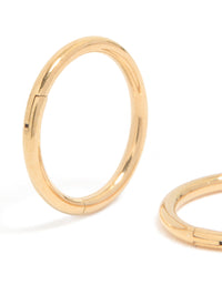 Highlighting chunky hoop sleeper earrings crafted from gold plated titanium close up view - link has visual effect only